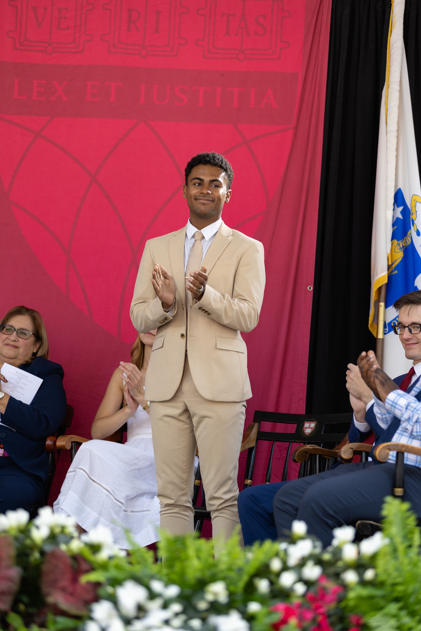 A man stands up on stage.
