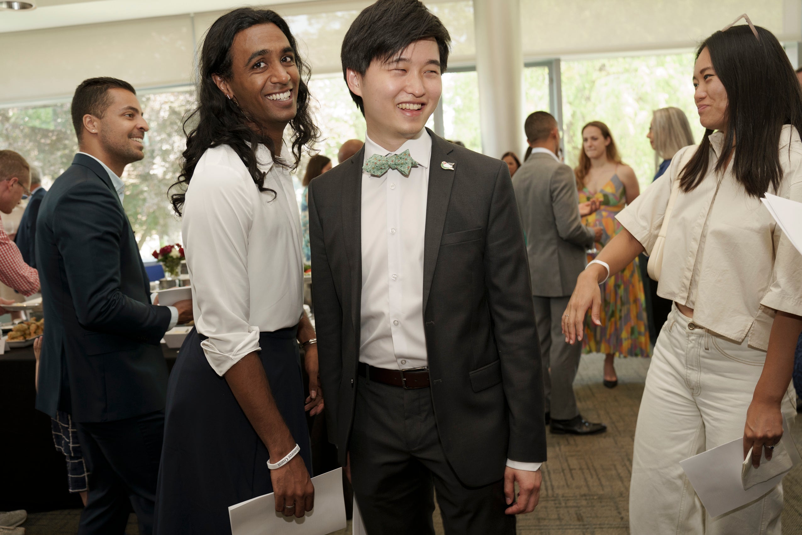 Two people standing together and smiling