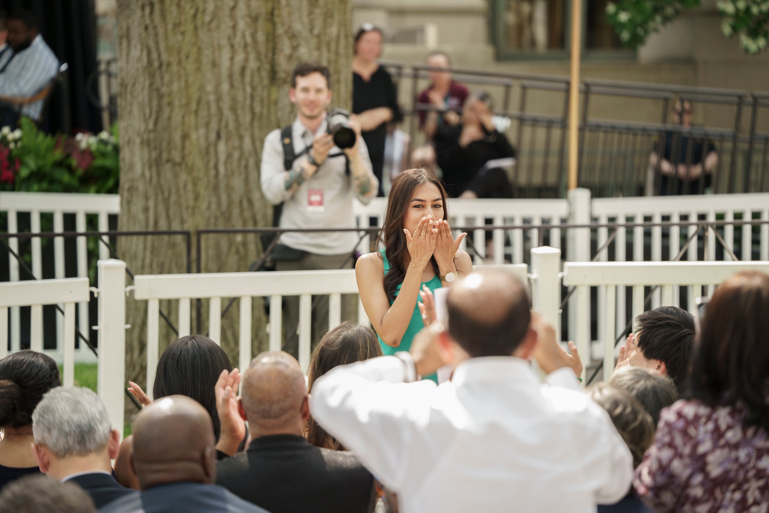 A woman blows a kiss to the audience