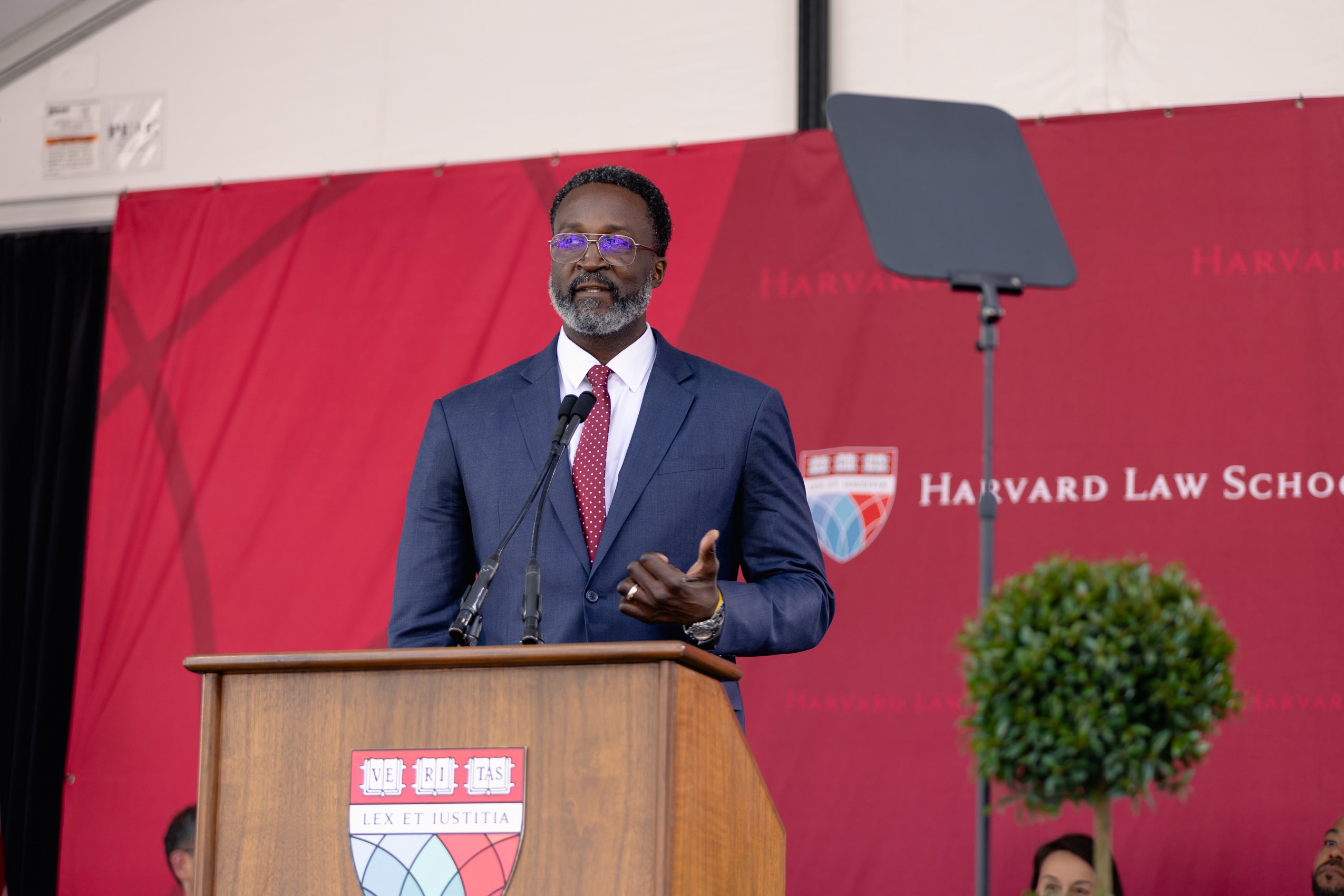 A man speaking at a podium