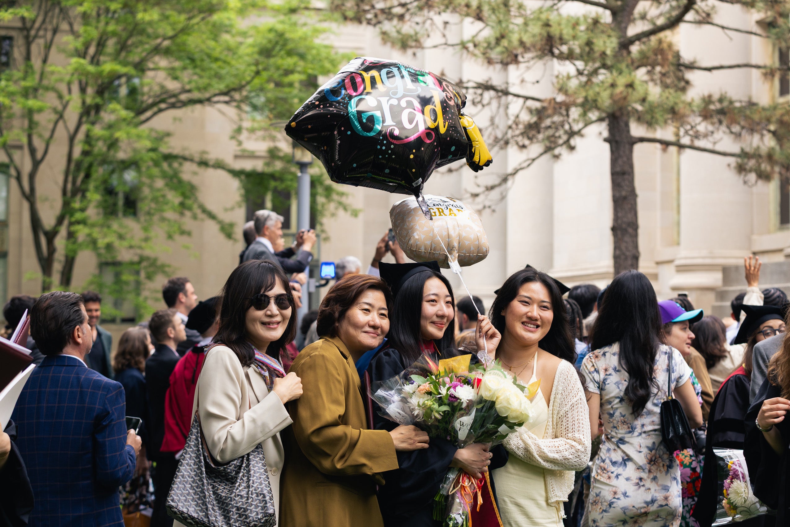 A graduate posing with her family
