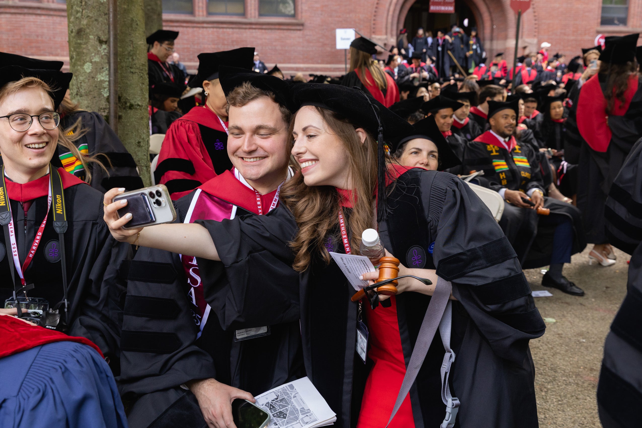 Two graduating students taking a selfie