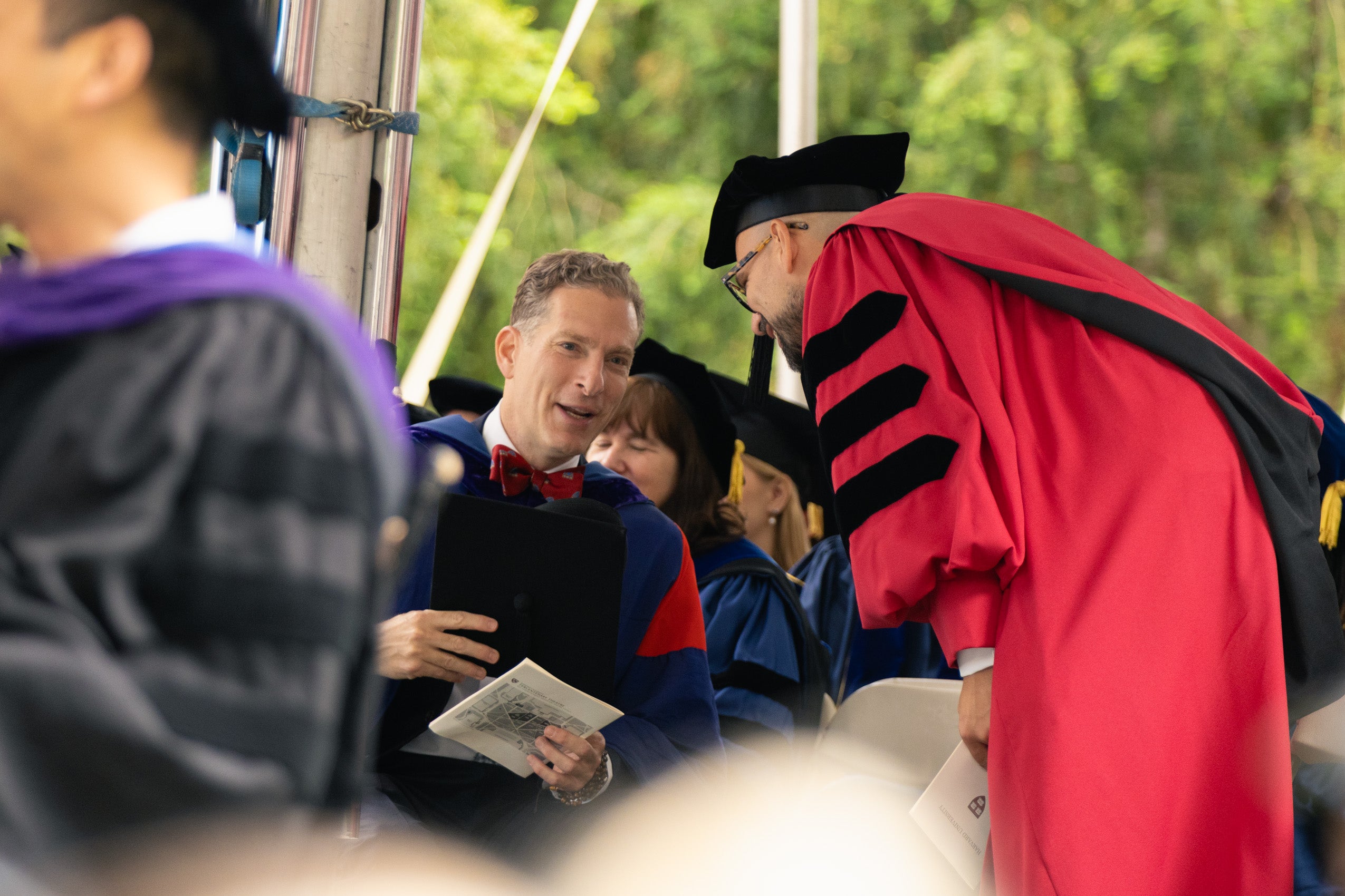 Faculty members chatting with each other