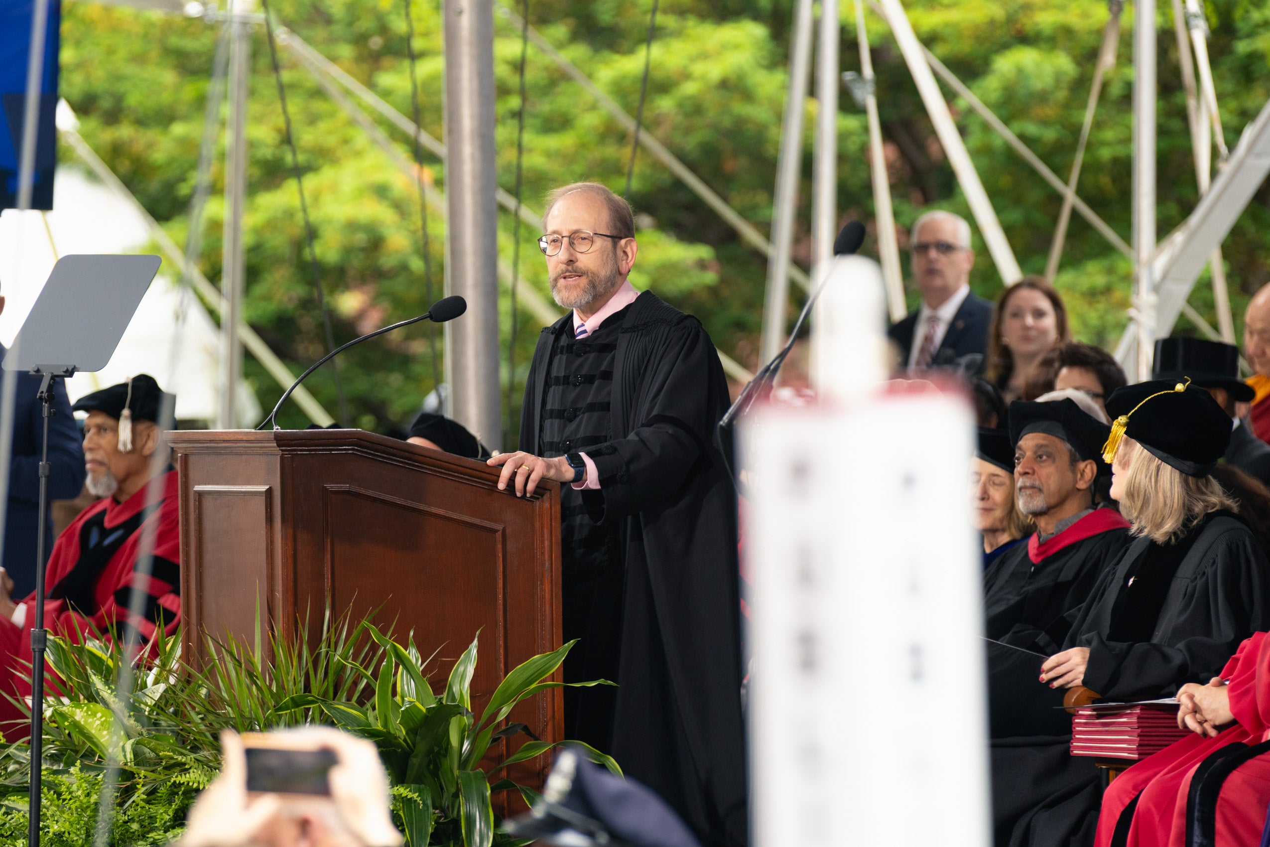 Alan Garber standing and speaking at a podium