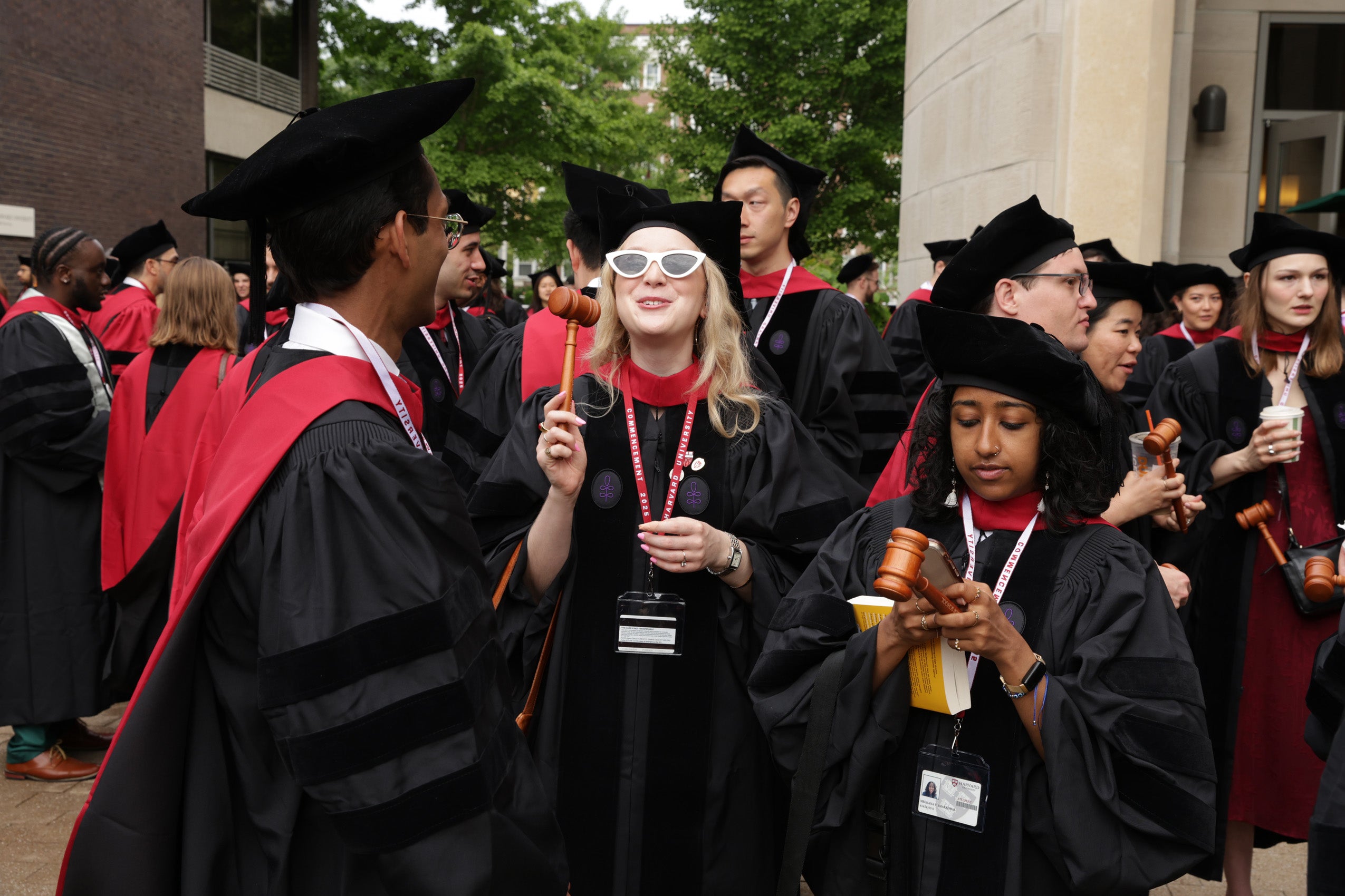 A graduating student poses with her gavel