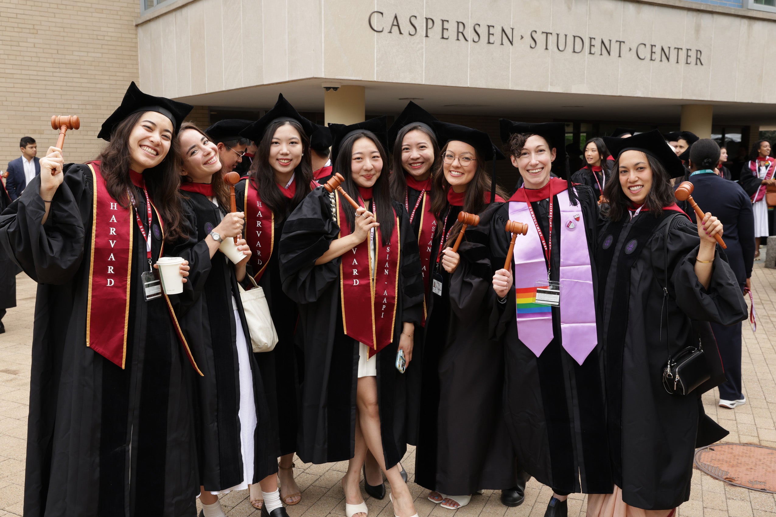 A group of graduates pose for a photo