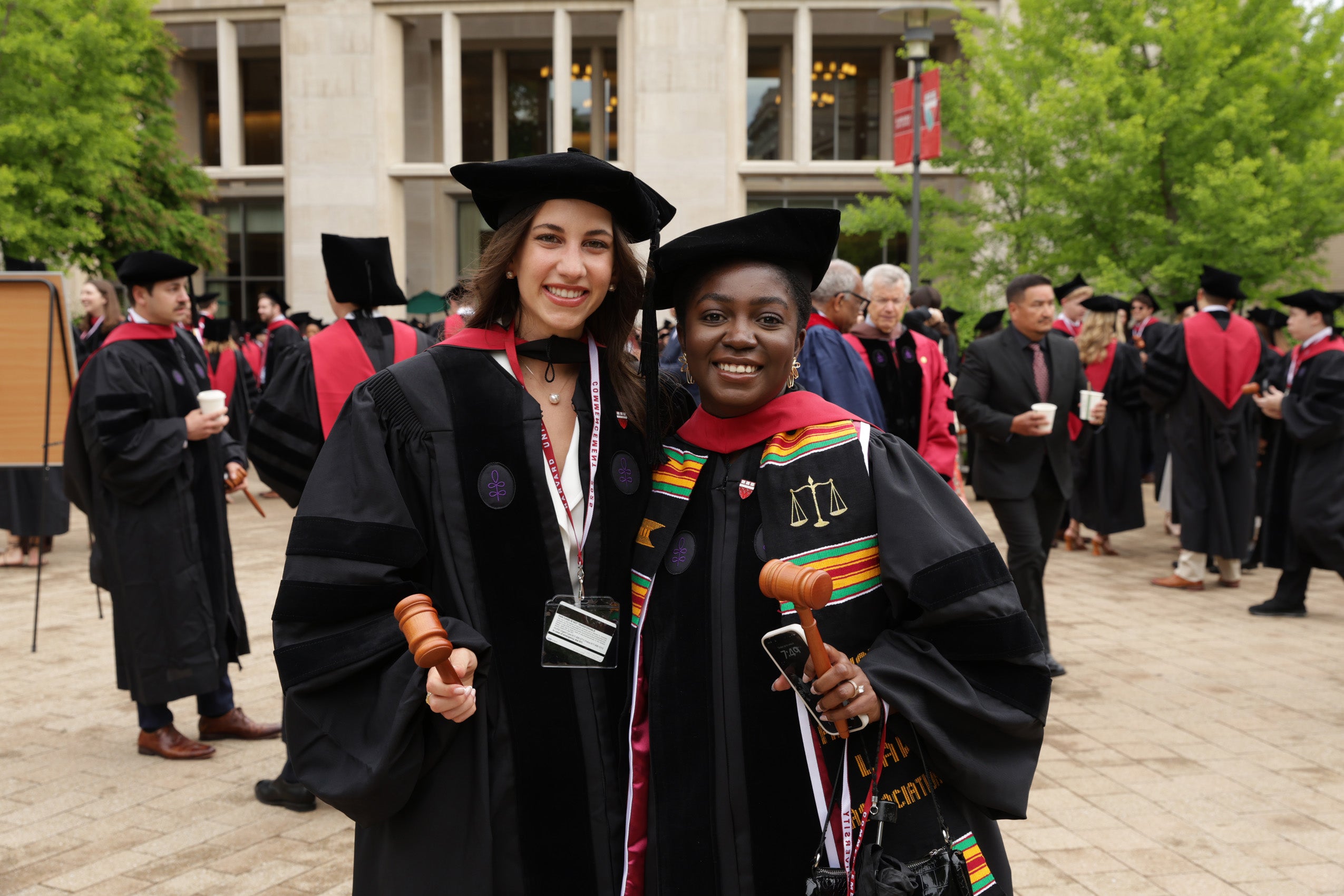 Two graduates smiling