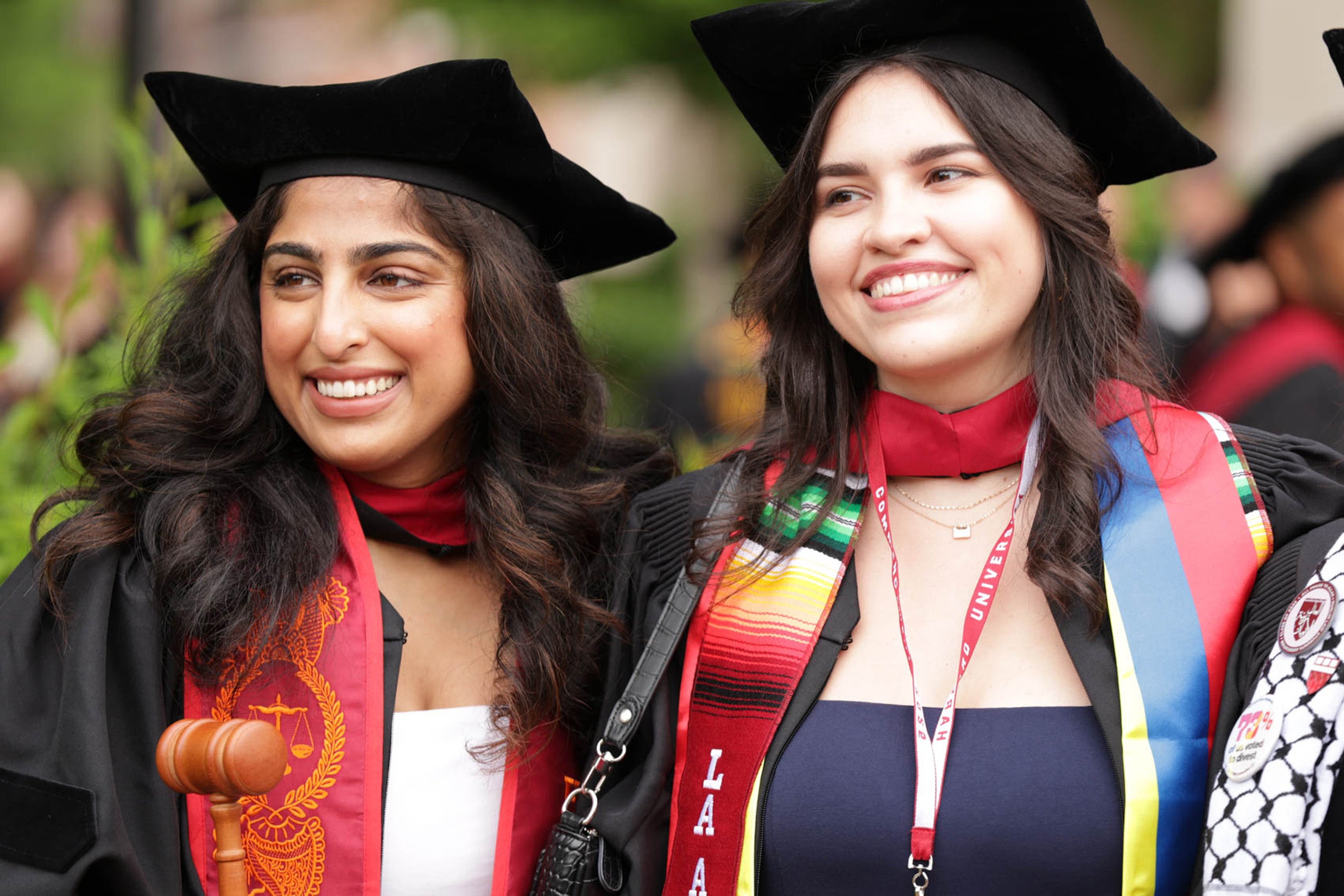 Two women smile proudly