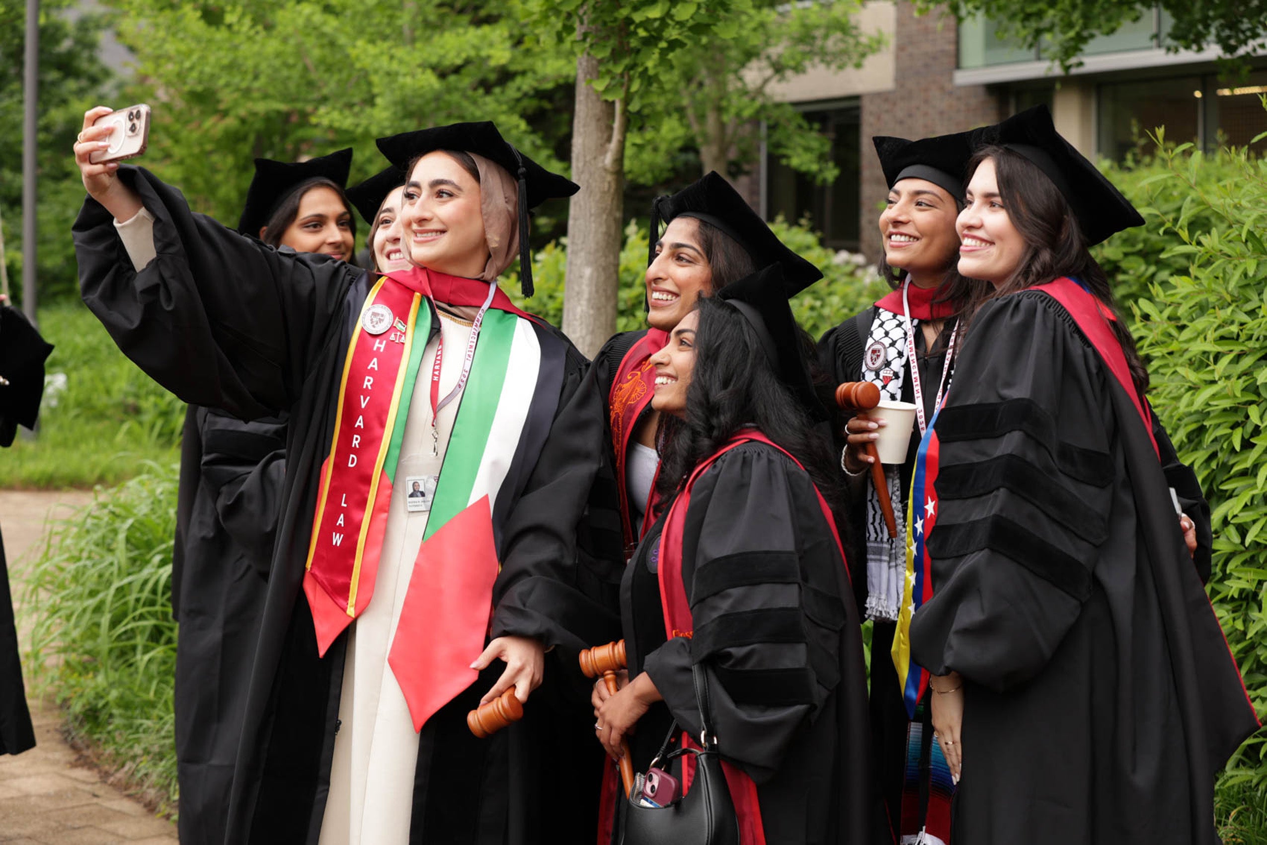 Group of graduates pose for selfie
