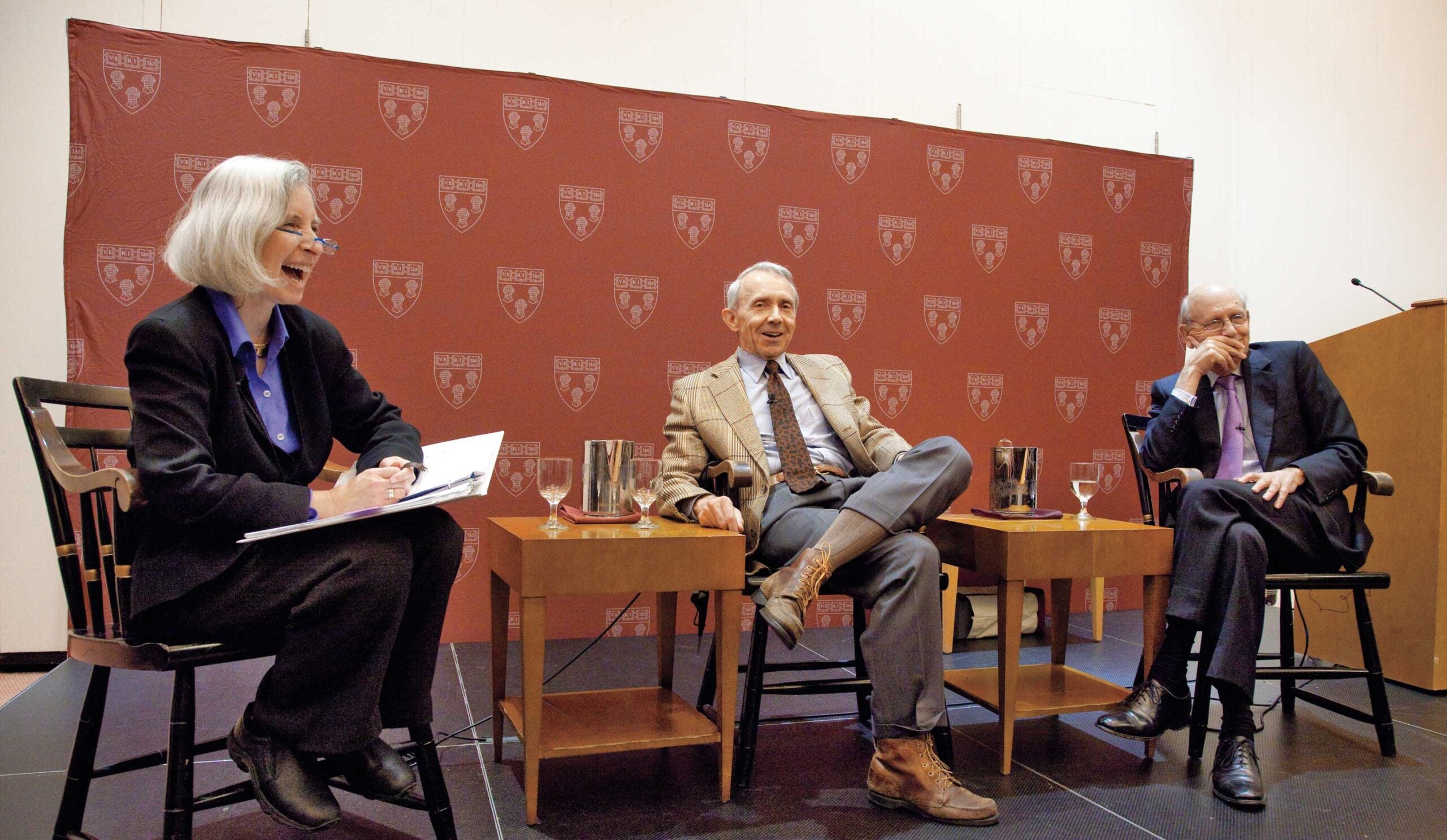 Martha Minow, David Souter, and Stephen Breyer sitting on a stage at an event