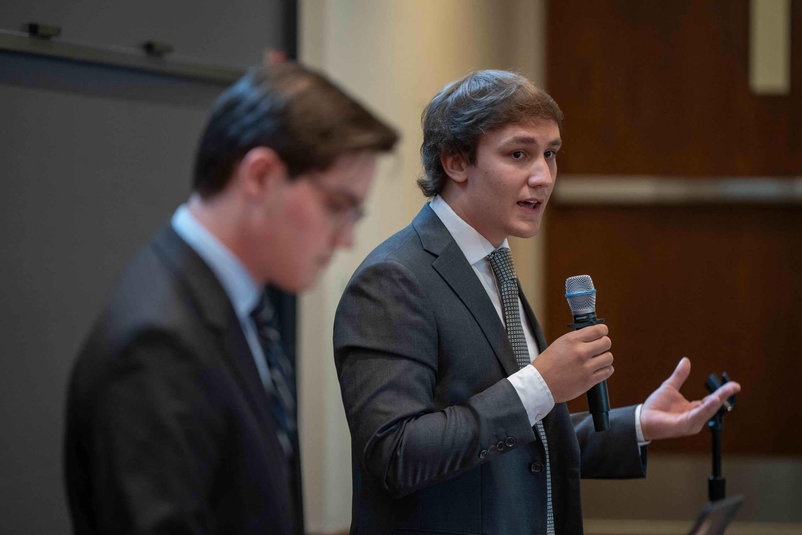 A student speaks during a debate.