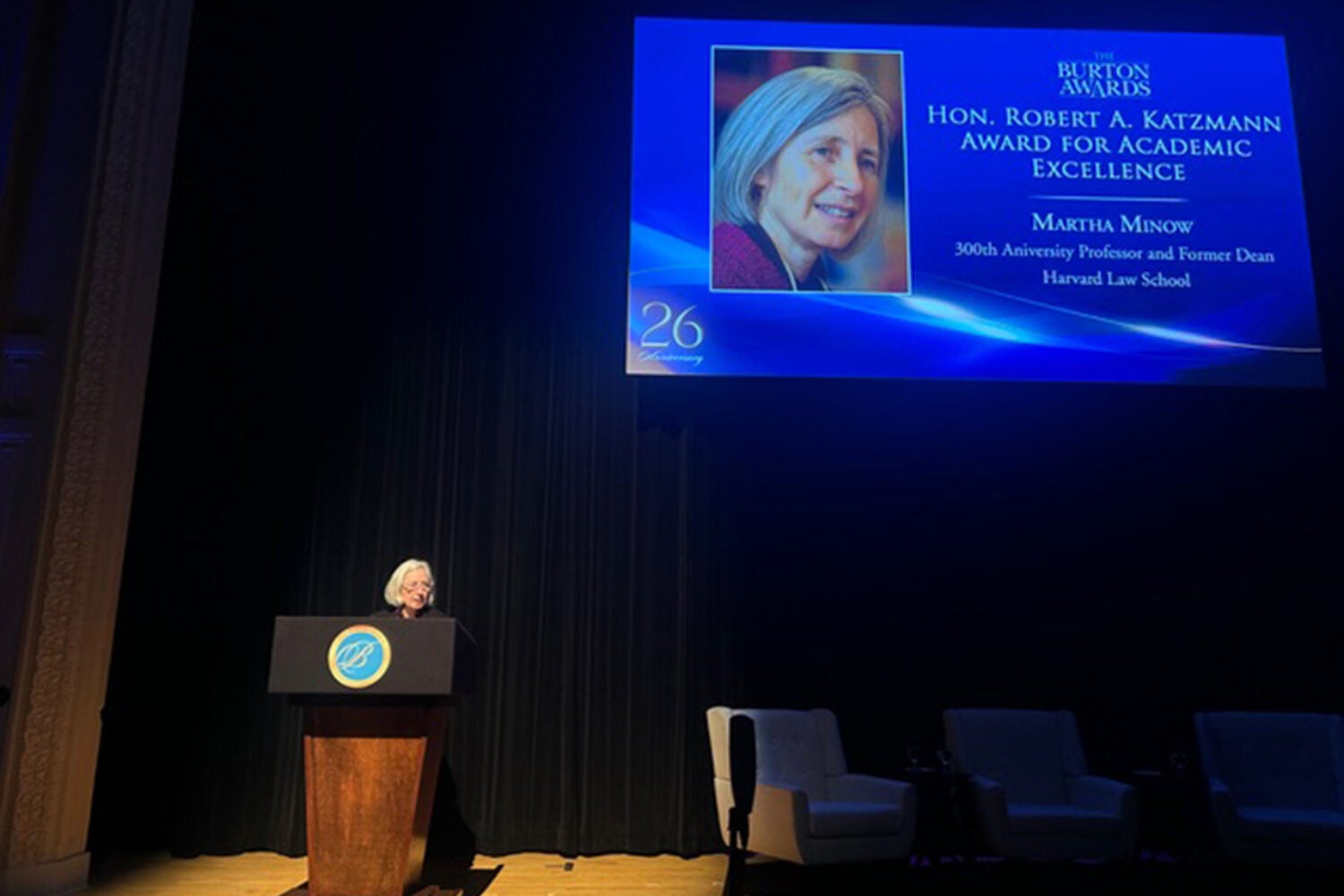 Woman at podium on stage
