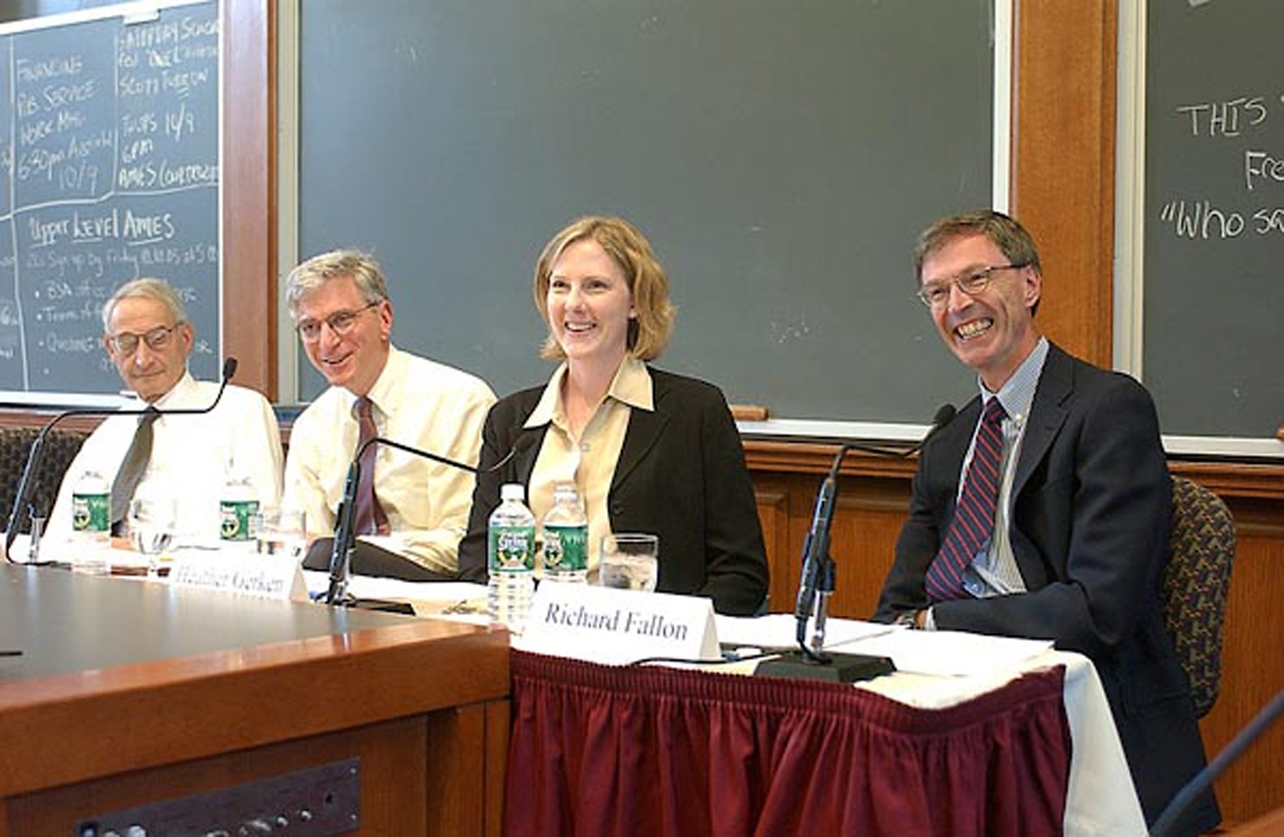 Richard Fallon with other faculty on a panel in a classroom.