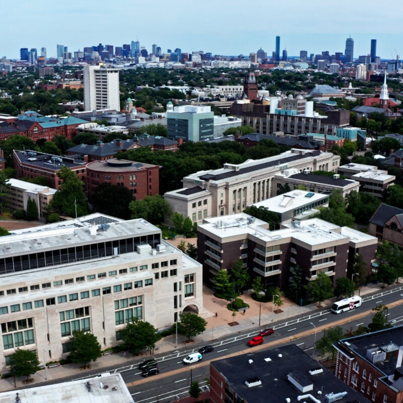 Aerial view of HLS campus with Boston skyline in the background.