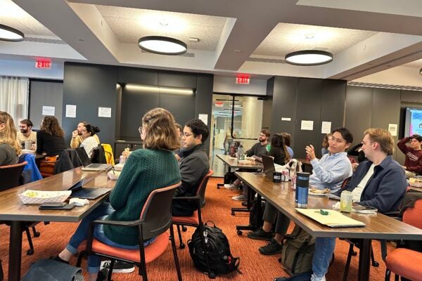 A group of HLS students listening to a presentation.