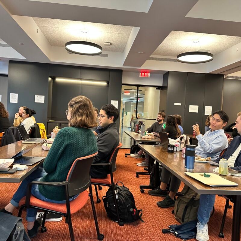 A group of HLS students listening to a presentation.
