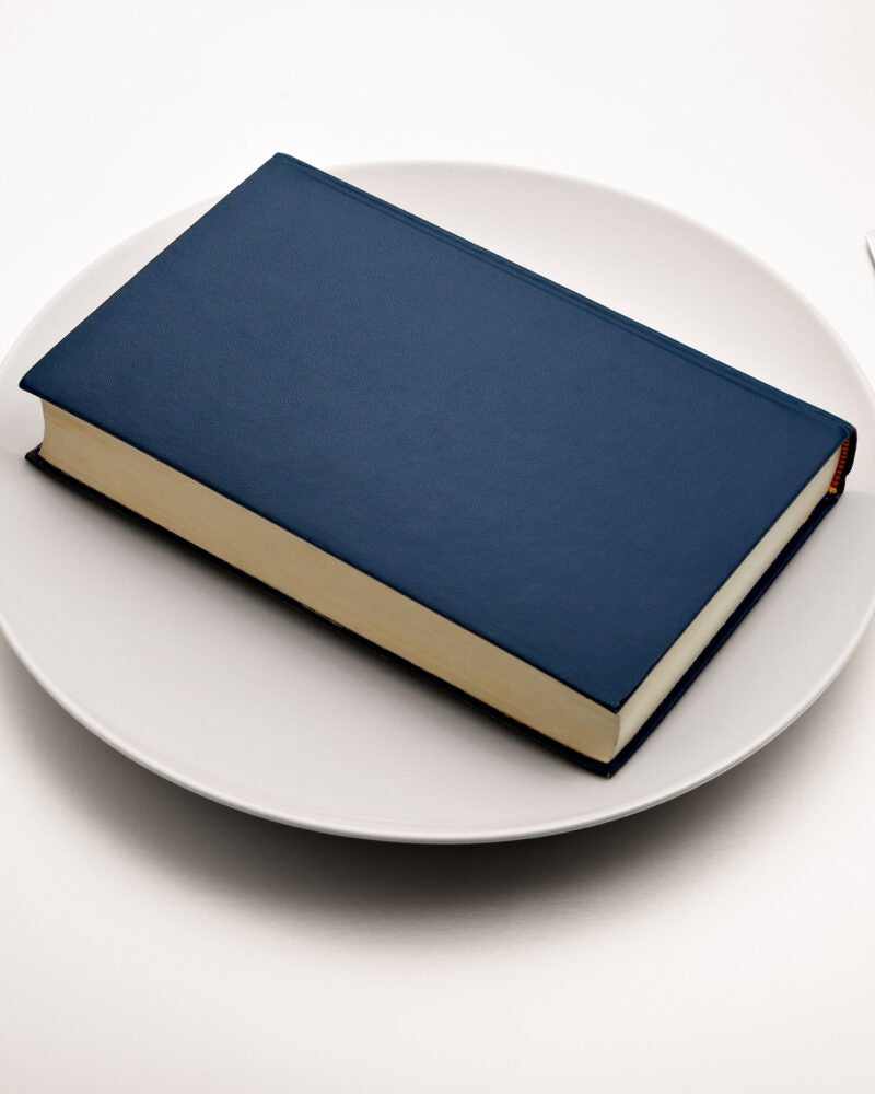 Blue book on a dinner plate