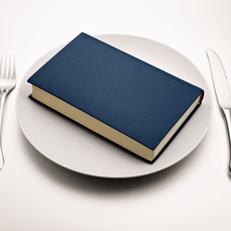 Blue book on a dinner plate