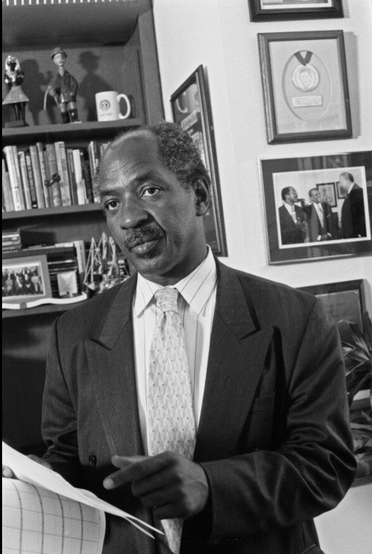 Professor Ogletree standing in his office at Harvard Law School.