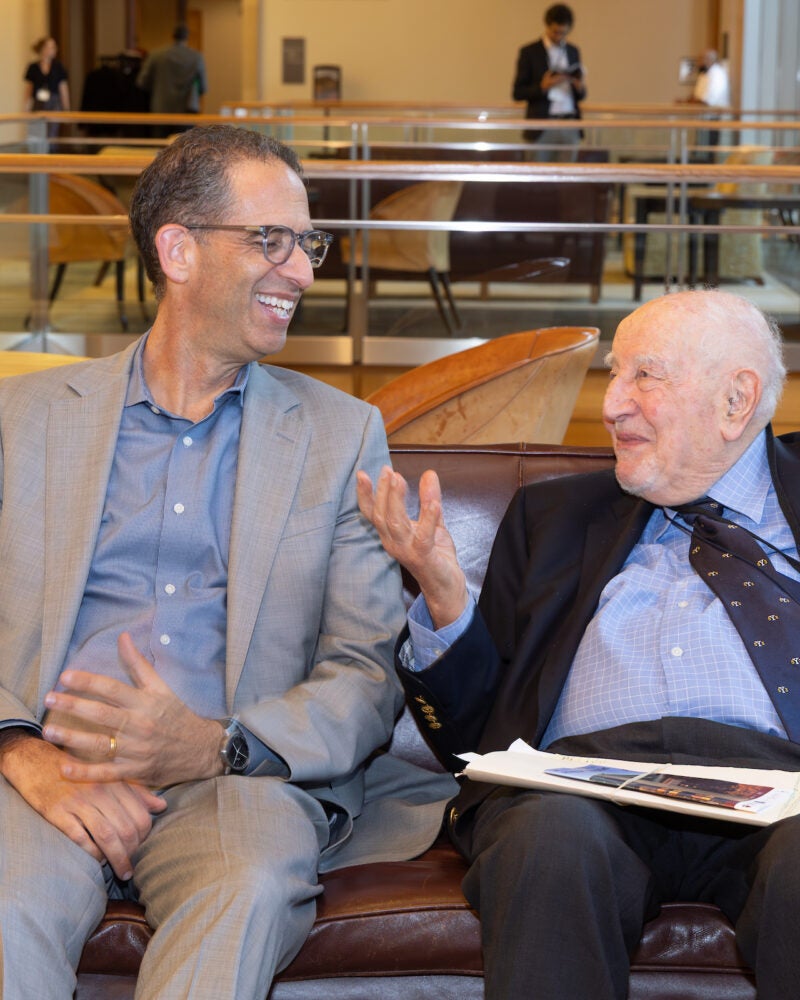 John Goldberg and Guido Calabresi chat casually.