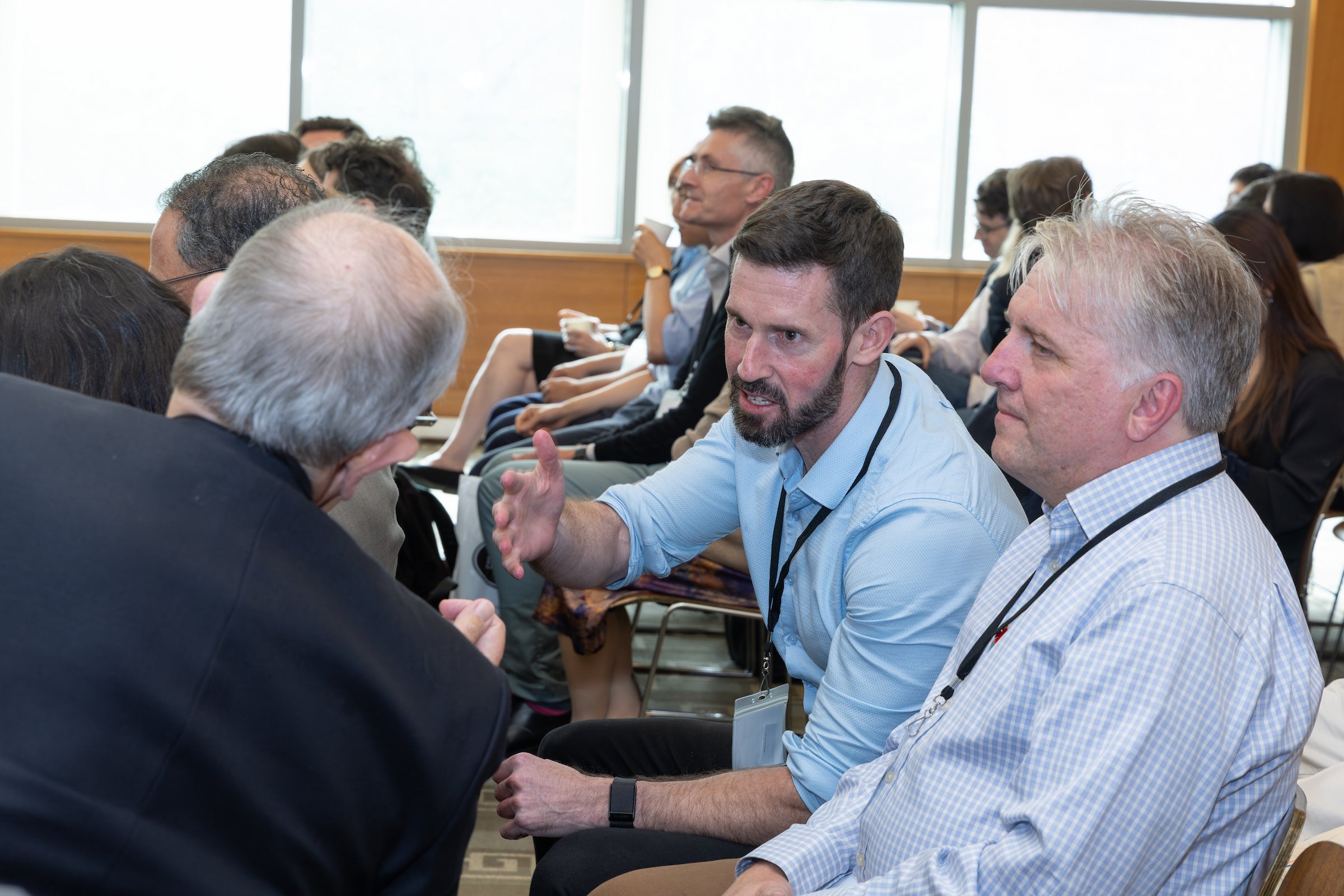 Obligations Conference attendees talking.