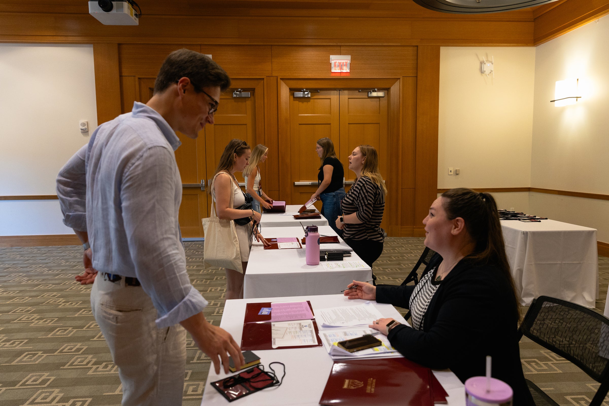 A student checks in during LL.M. orientation.