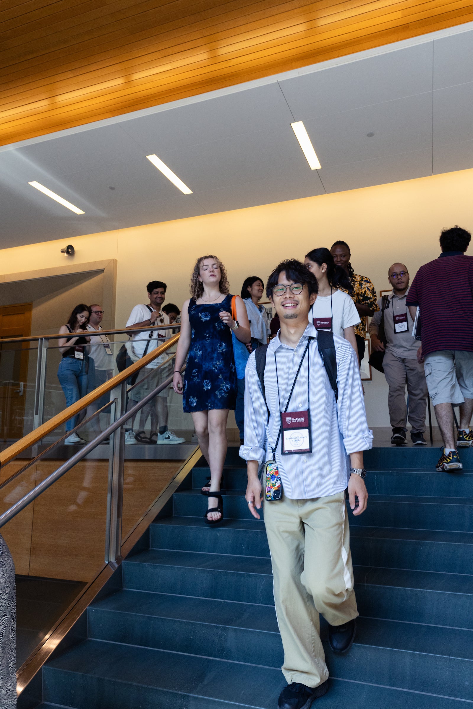 LL.M. students walk down the WCC main staircase during check-in day.