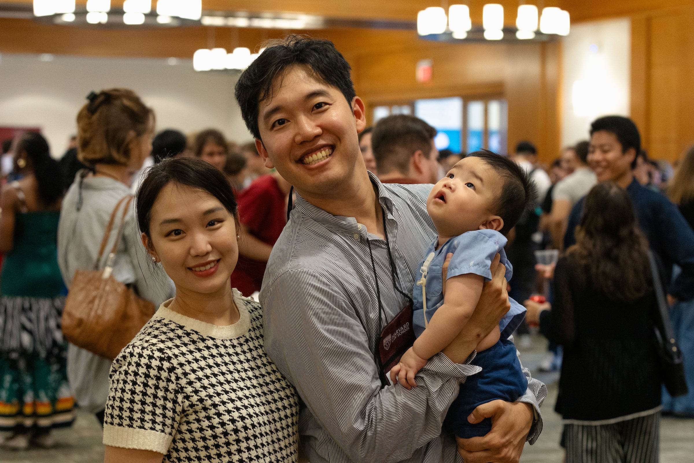 Two students with a young baby at the LL.M. welcome reception.