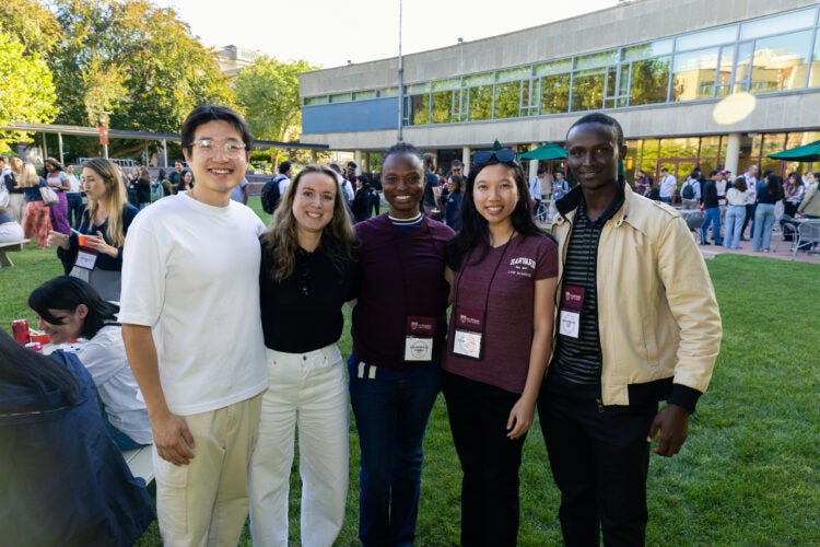 Five students pose for a photo.