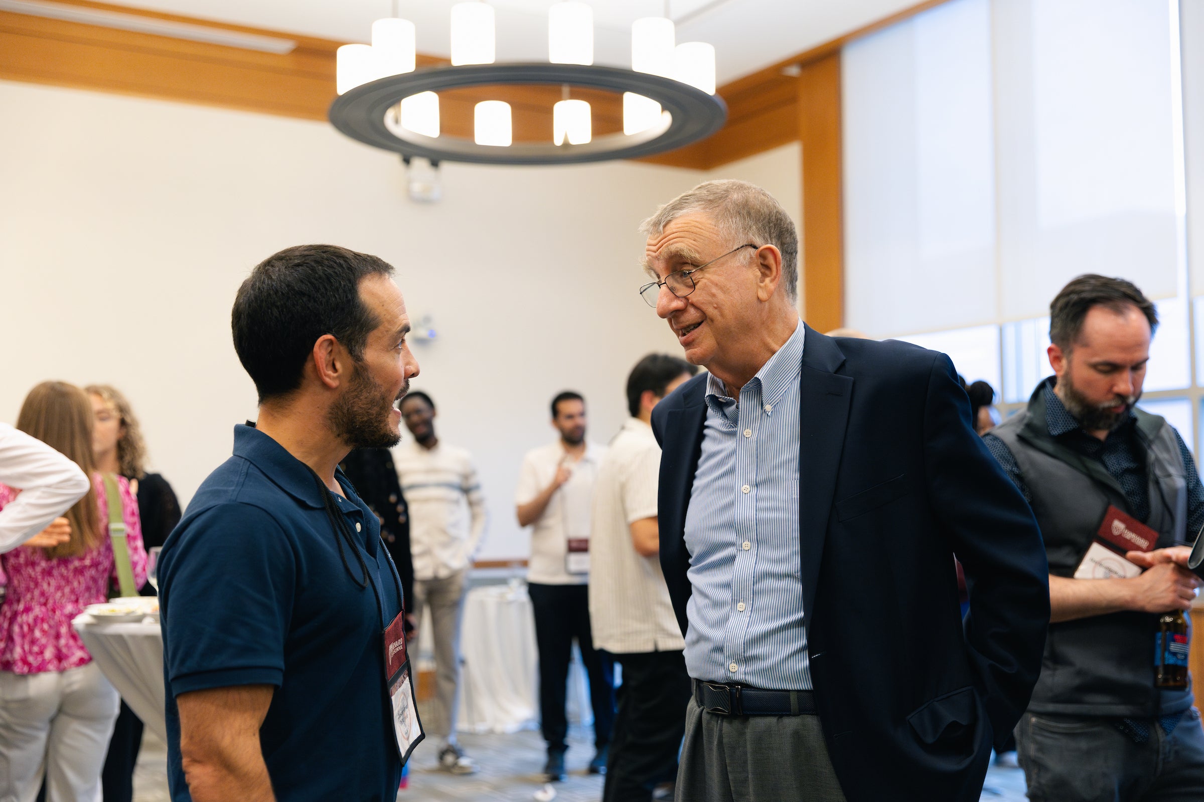 Professor Alford speaks with student.