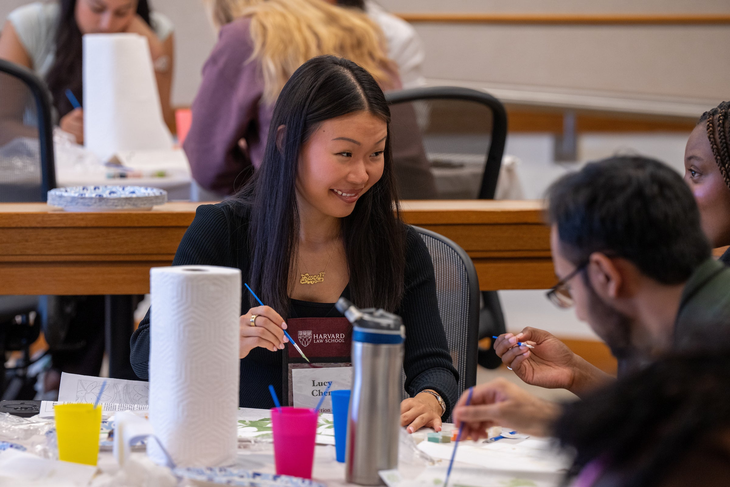Students take part in a painting activity during a pre orientation event known as Day Zero.