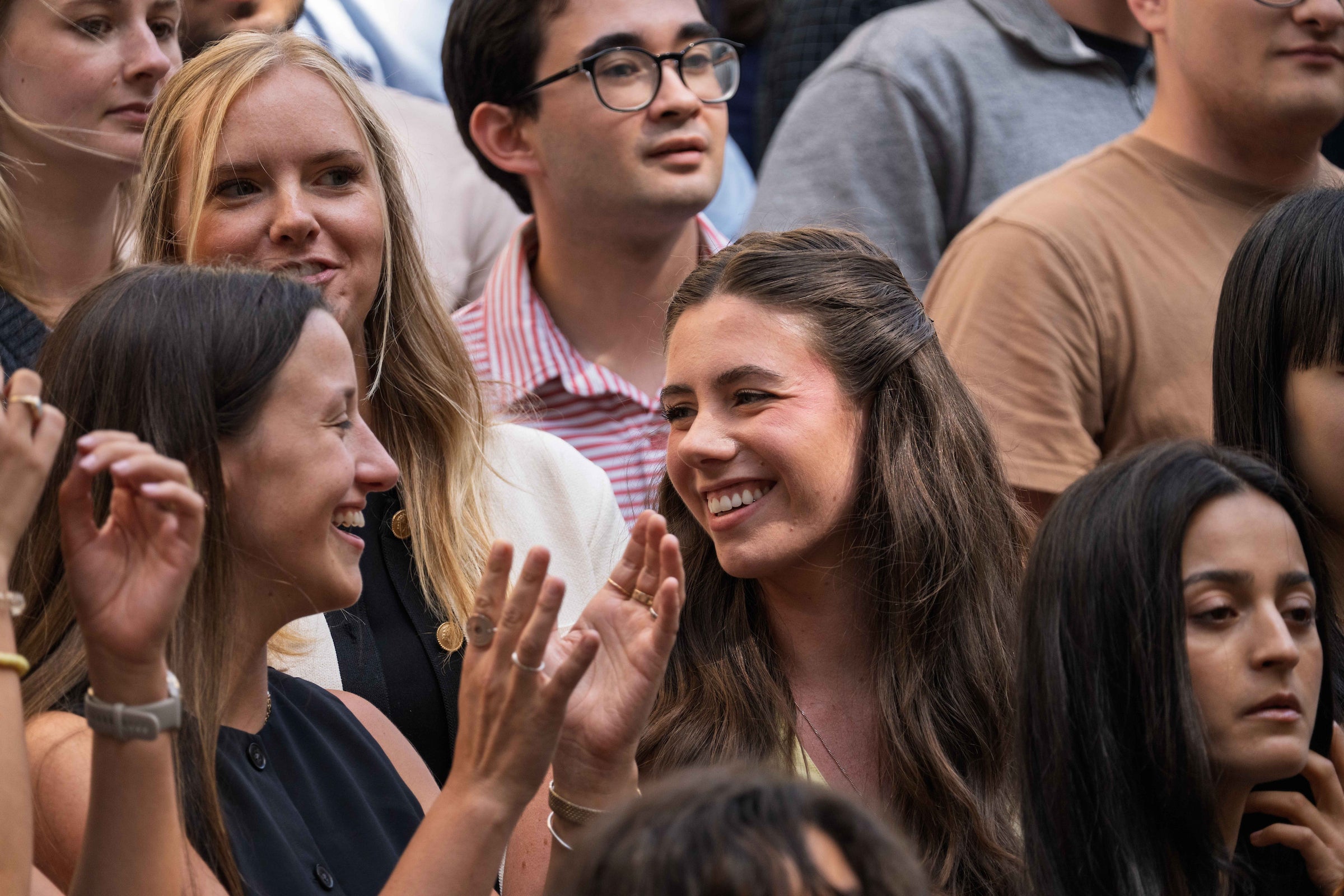 A close up of two students as they took part in the transfer and exchange student group photo.
