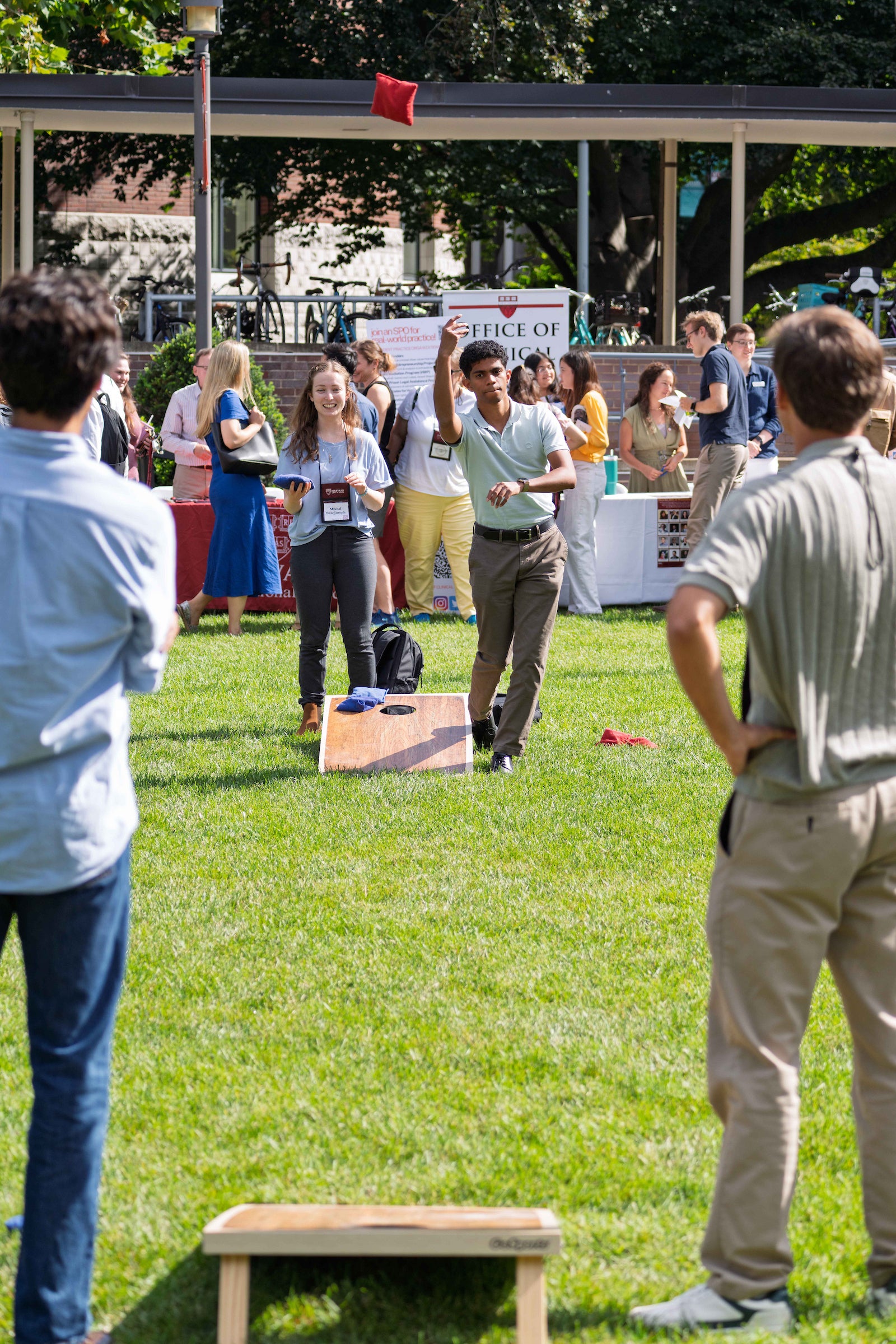 Students play a game on the lawn of campus during an orientation event.