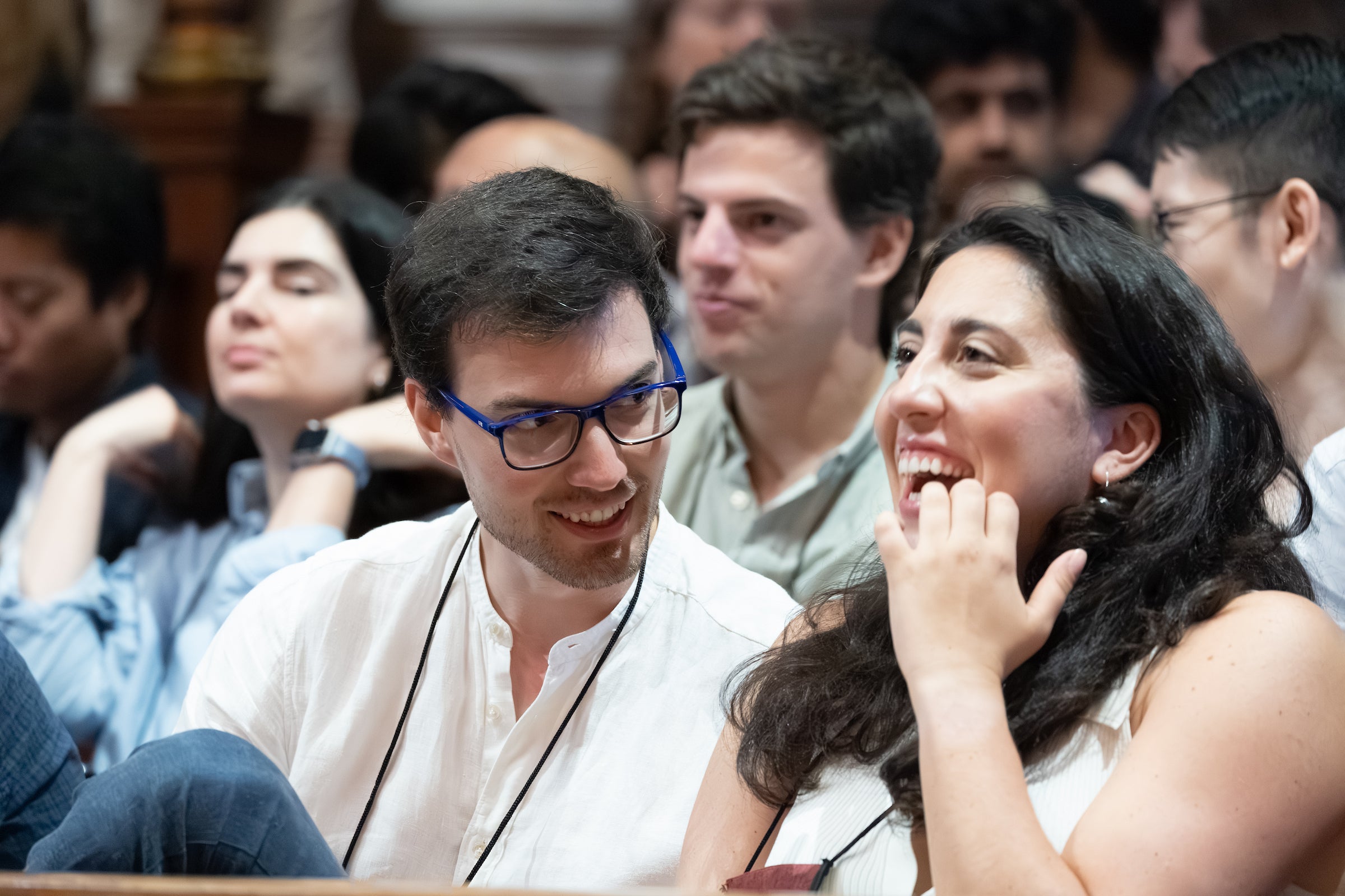 Students listening to remarks at an event.