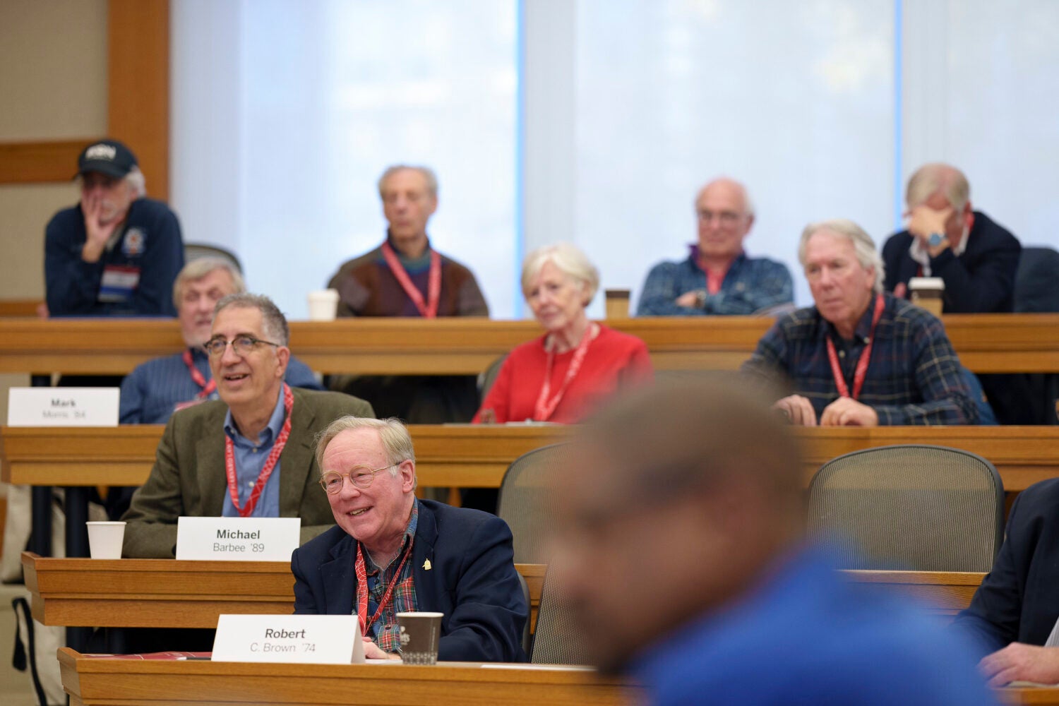 HLS Alumni in a classroom on campus.