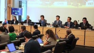 Panel of people speaking at conference.
