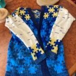 Hand-knitted sweater with puzzle-piece design