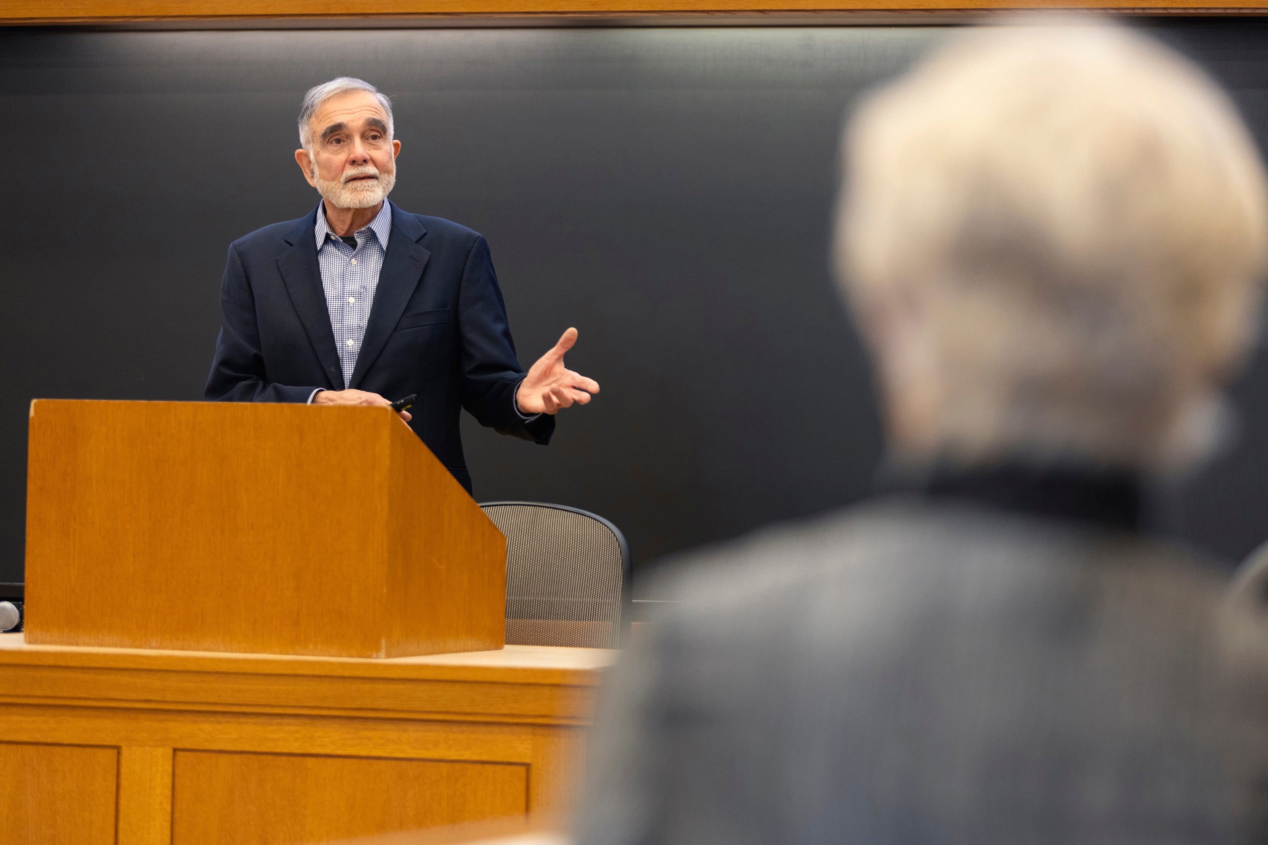 Professor John Leshy speaking at a podium