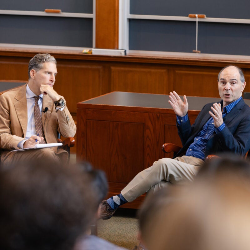 Richard Primus speaking as Noah Feldman and students listen.