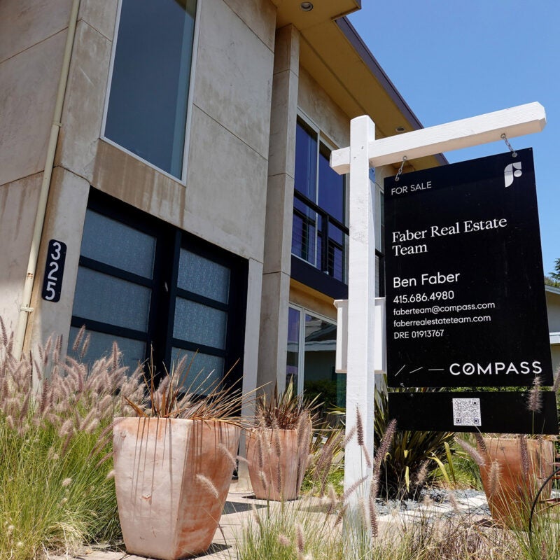 A For Sale sign in front of a home in California.