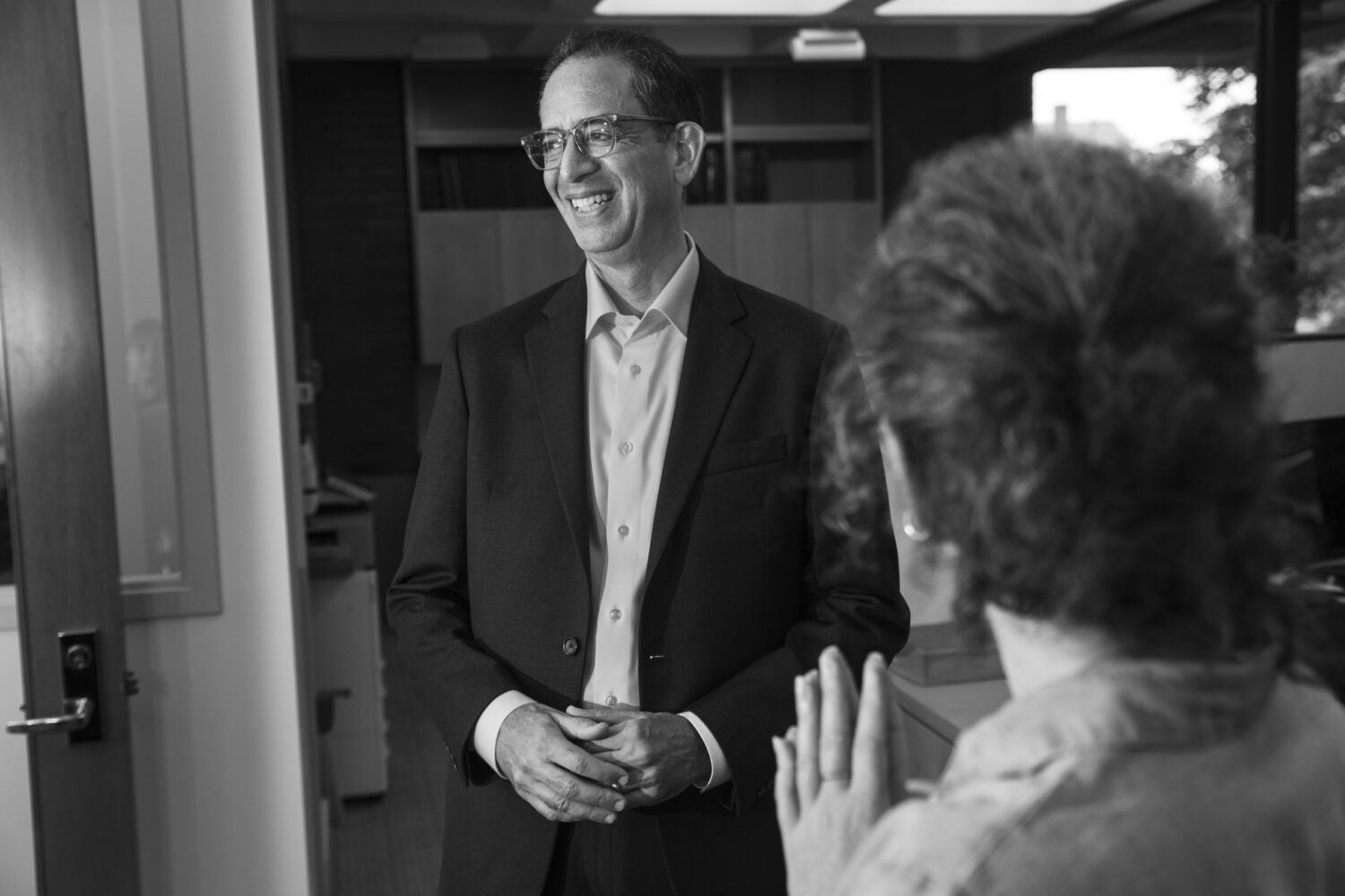 John Goldberg speaking to someone in his office.