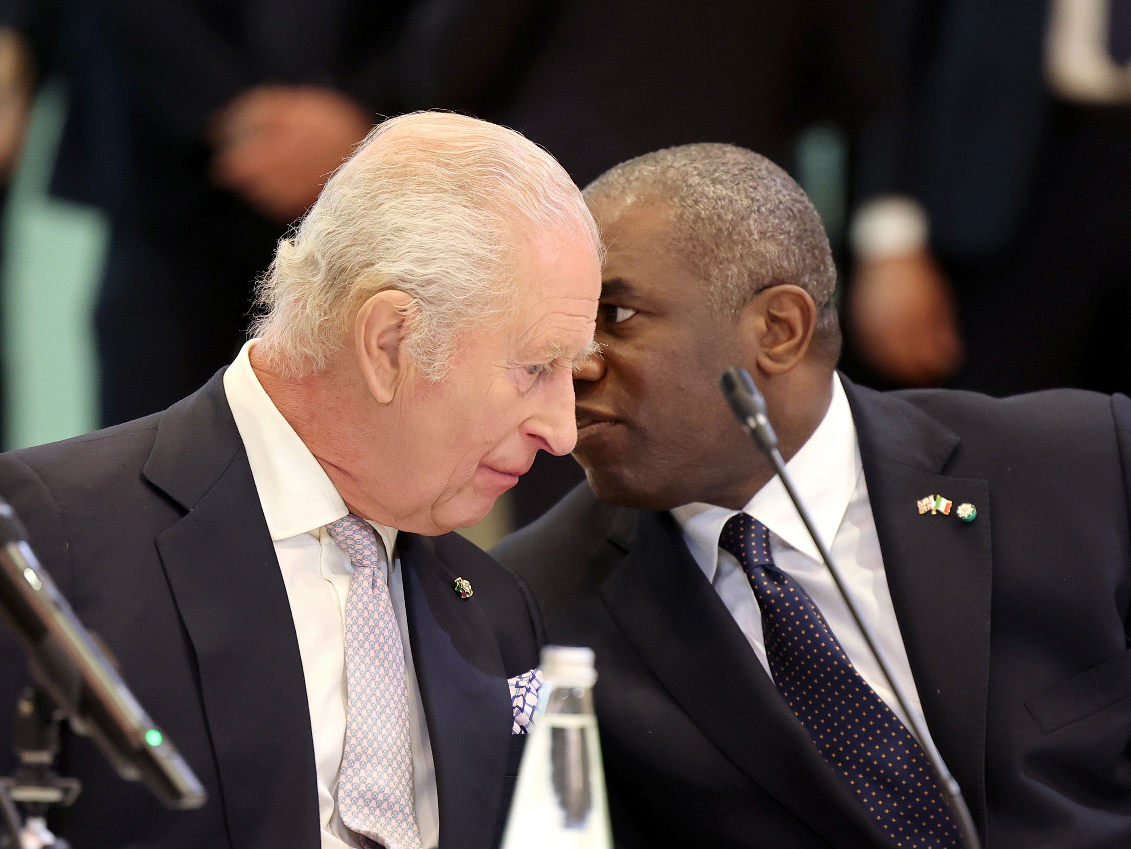 Charles III and UK Secretary of State David Lammy speaking