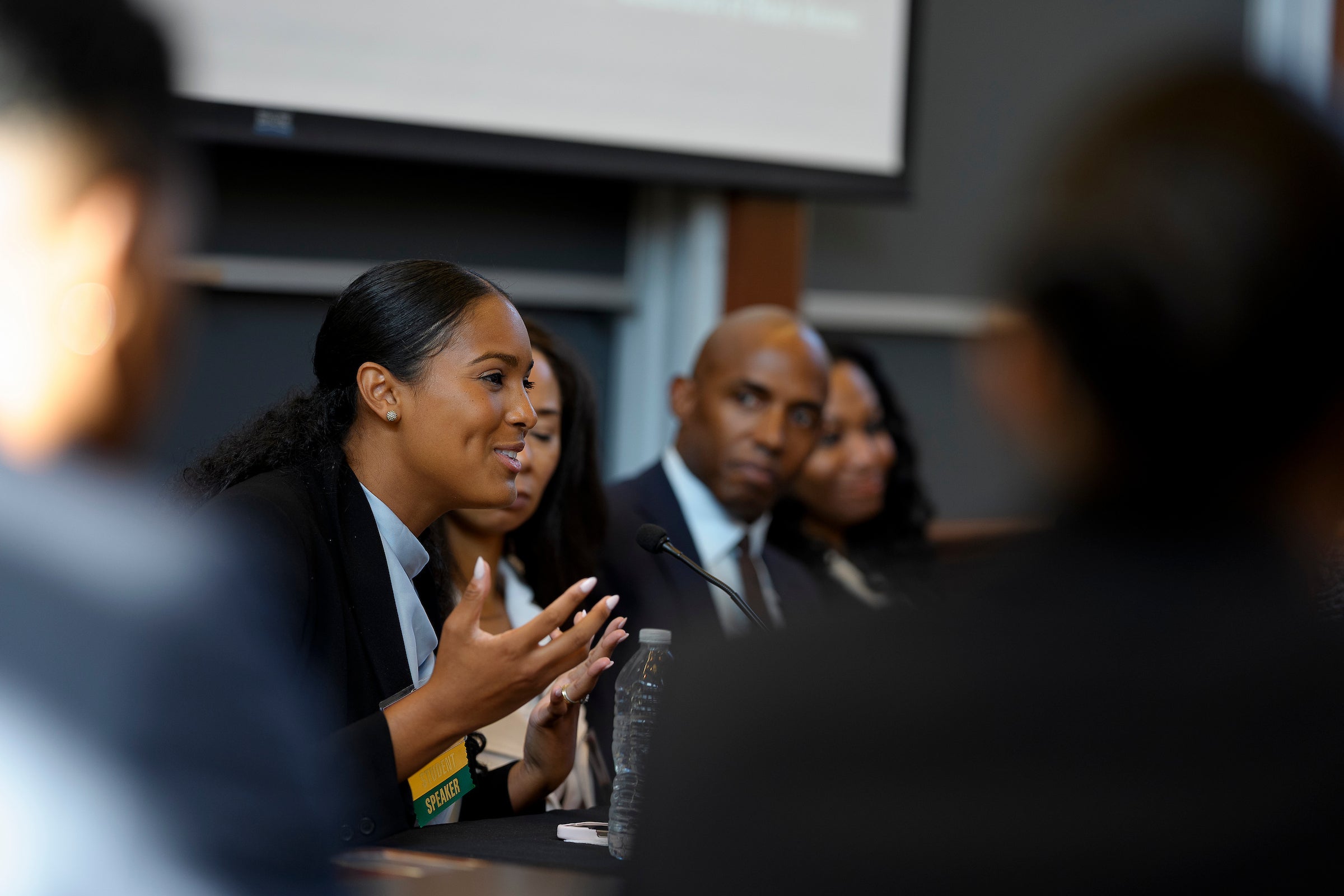 A woman speaking on a panel.