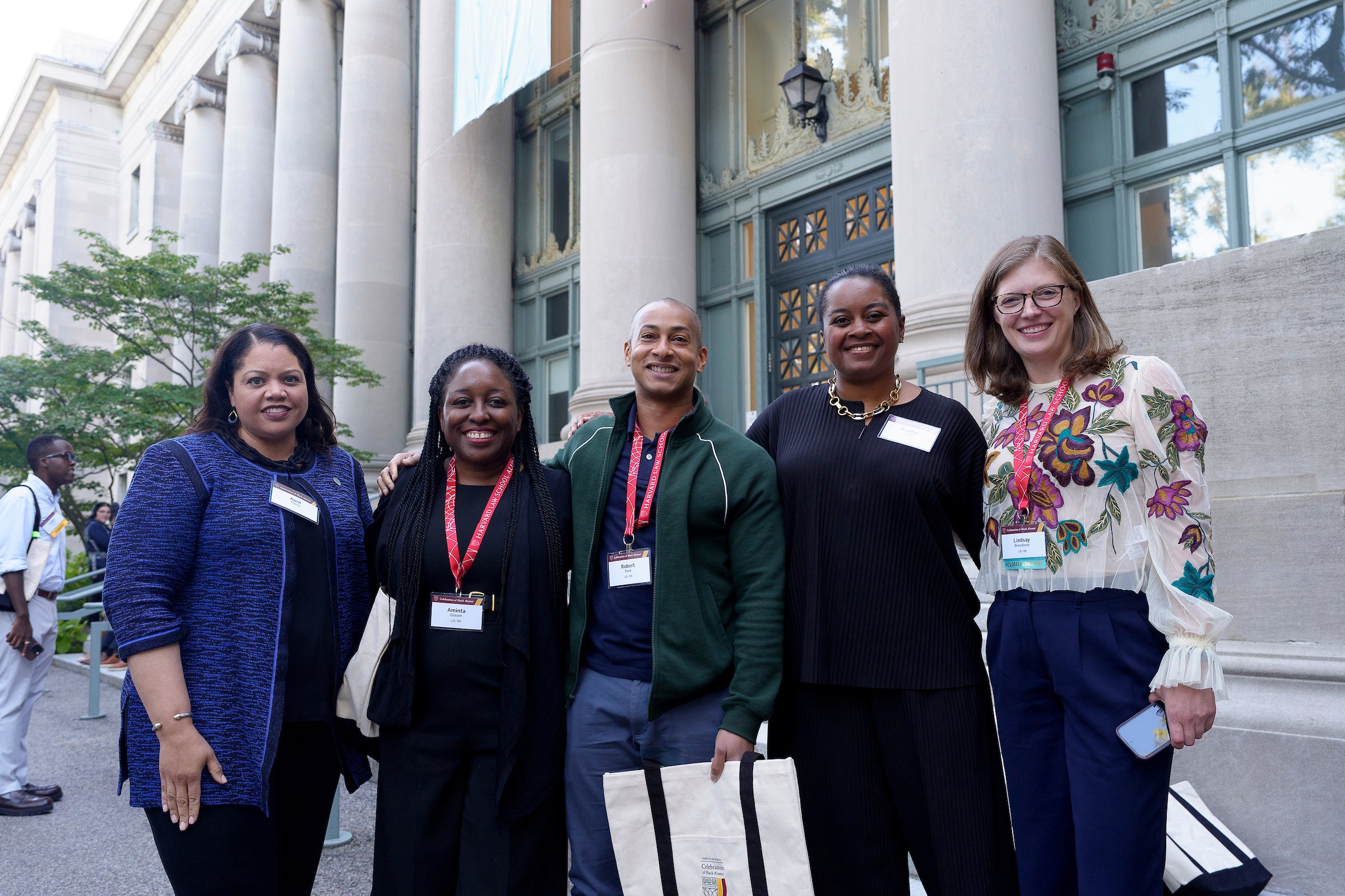 A group of women in front of a building.