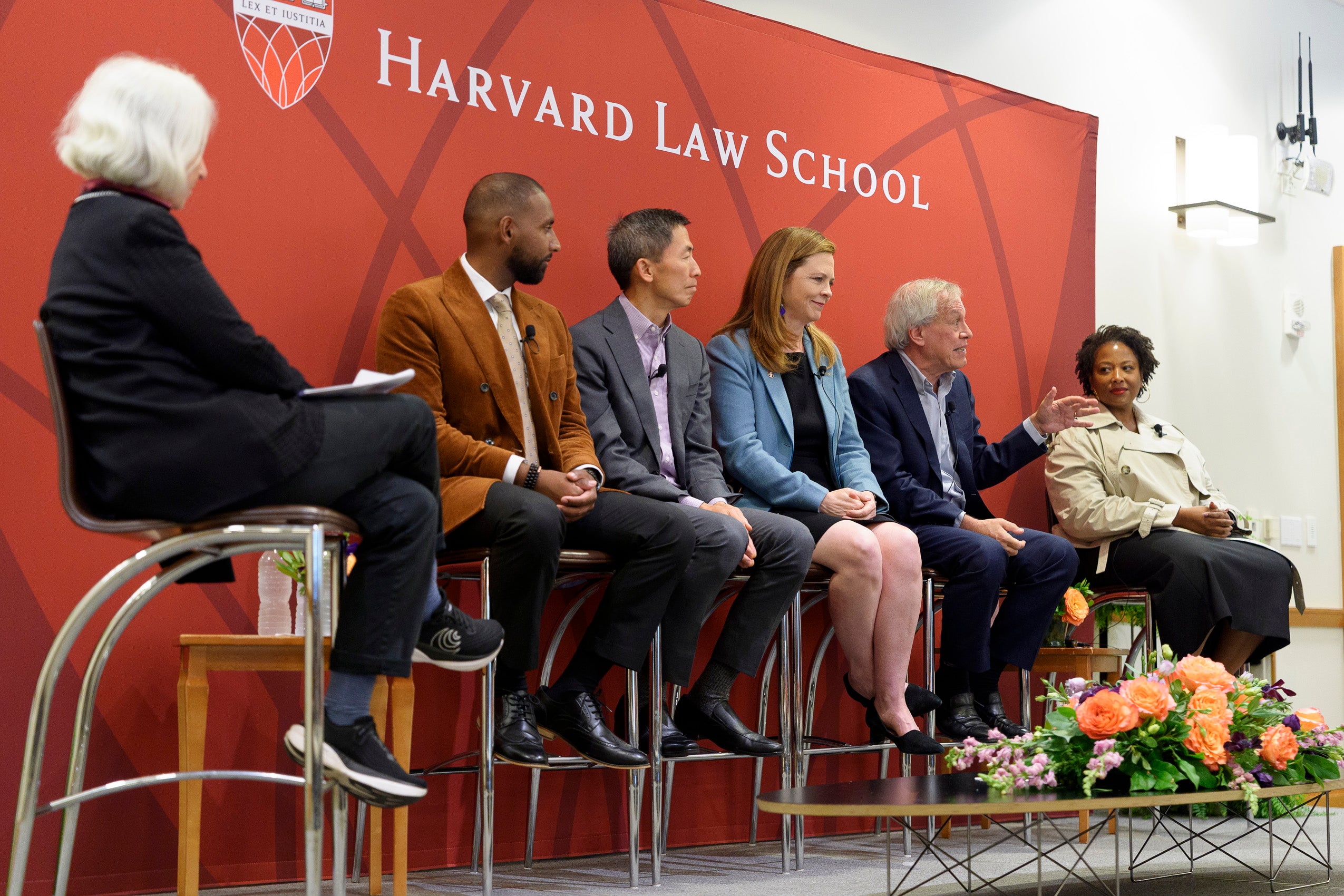 A group of panelists on a stage.