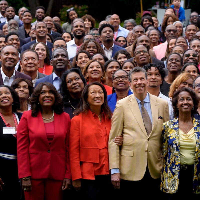 A large group of people pose for a photo at an event.