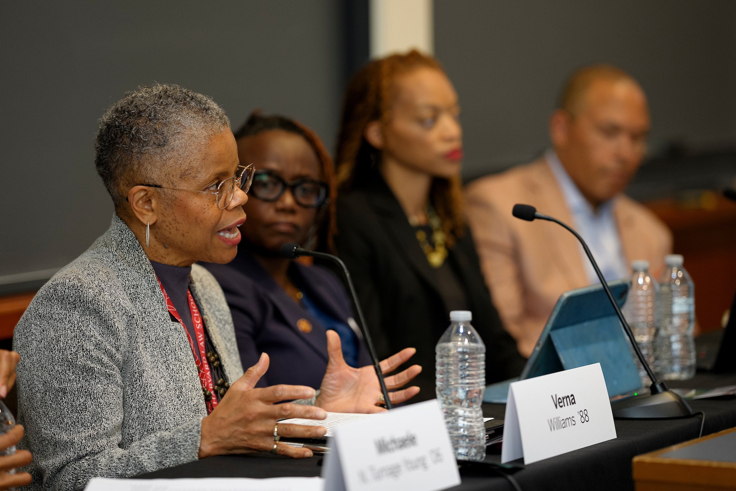 A panelist speaking at an event.