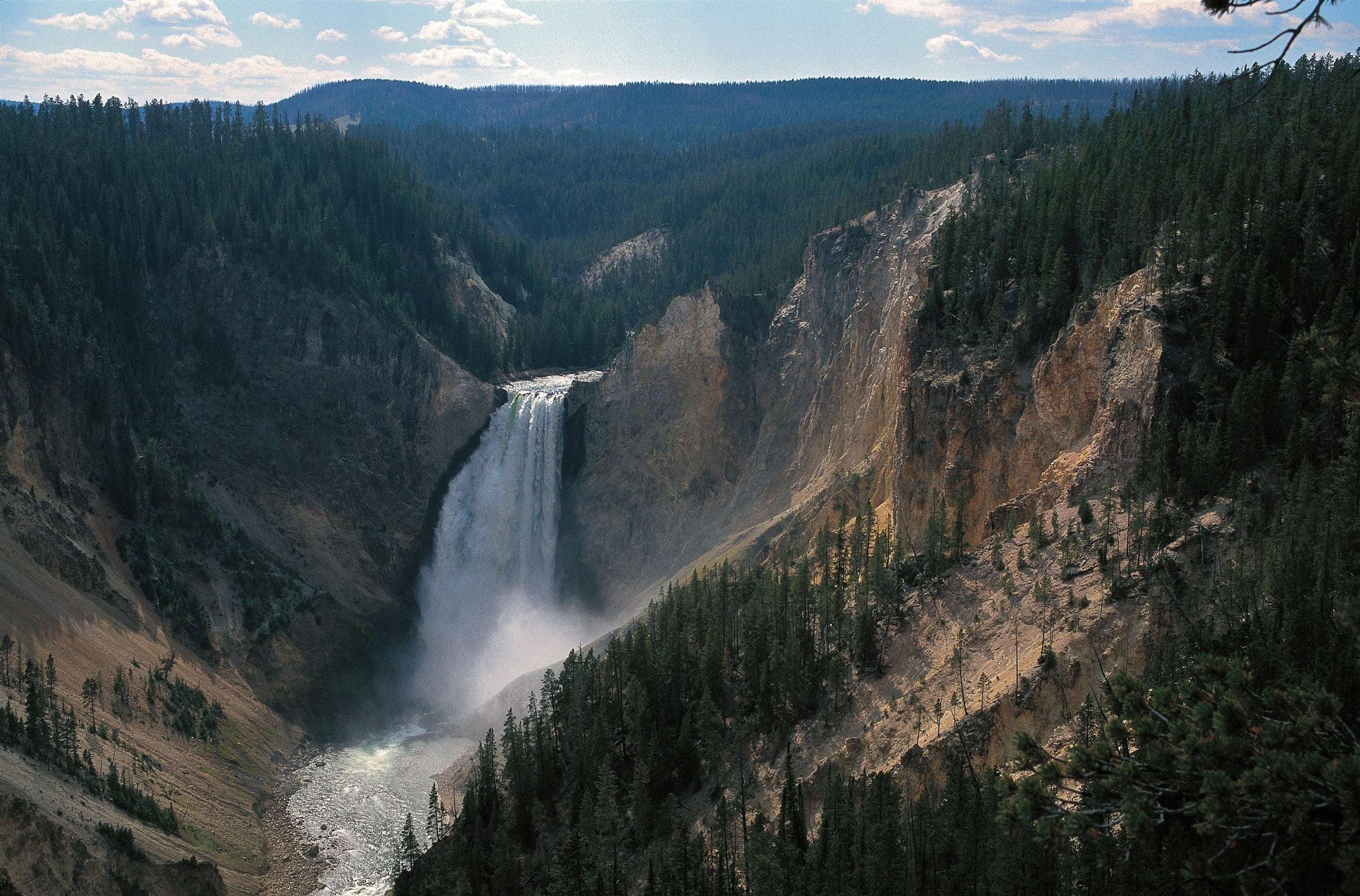 Waterfalls flow through a mountain.