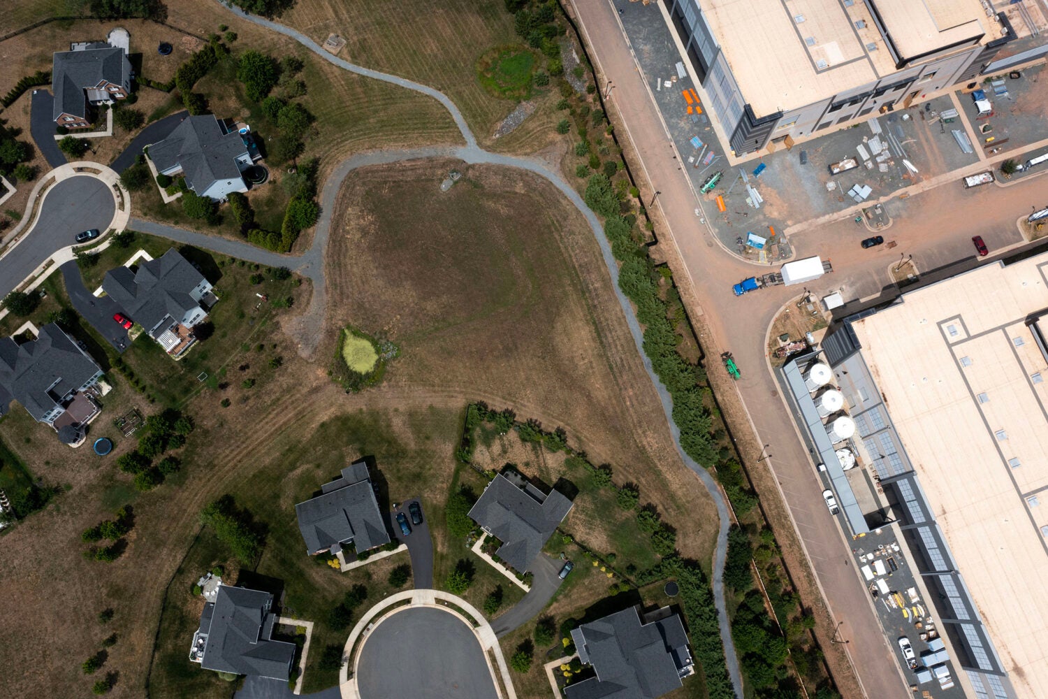 Aerial view of homes adjacent to a large data center in Northern Virginia.