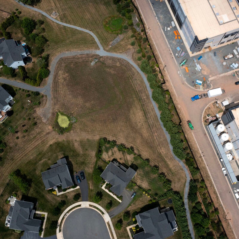Aerial view of homes adjacent to a large data center in Northern Virginia.